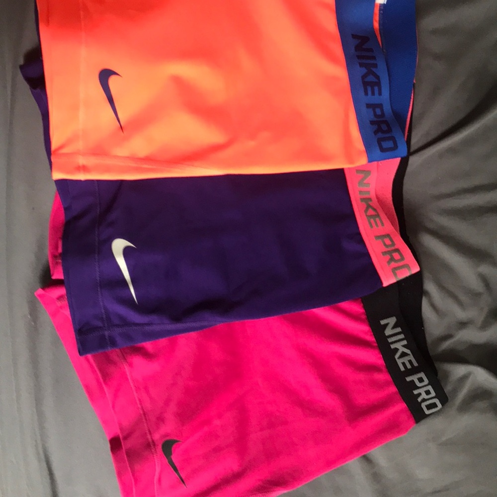 Three pairs of Nike pros